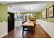 Dining room, open to kitchen, with views of fireplace at 8166 E Phillips Ave, Centennial, CO 80112