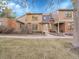 Lovely townhome boasts a manicured lawn, brick and wood accents, and a welcoming walkway to the front door at 8166 E Phillips Ave, Centennial, CO 80112