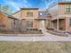 Inviting townhome showcasing a well-kept yard, brick details, and a quaint entrance with a skylight above at 8166 E Phillips Ave, Centennial, CO 80112