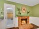 Fireplace in the dining room, with access to outdoor deck at 8166 E Phillips Ave, Centennial, CO 80112