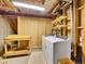 Functional laundry area with washer, dryer, and shelving in an unfinished basement at 8166 E Phillips Ave, Centennial, CO 80112