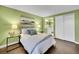 Bright main bedroom featuring hardwood floors and ensuite bathroom with vanity mirror at 8166 E Phillips Ave, Centennial, CO 80112