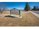 Sign for Willow Creek Park with lush green surroundings and a clear blue sky at 8166 E Phillips Ave, Centennial, CO 80112