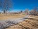 Gravel pathway winding through a park with trees and clear blue sky at 8166 E Phillips Ave, Centennial, CO 80112