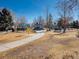 Community playground with swings, slides, and play structures, set amongst trees and grass at 8166 E Phillips Ave, Centennial, CO 80112