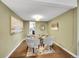 Cozy sitting area with four armchairs and view into kitchen through open doorway at 8166 E Phillips Ave, Centennial, CO 80112