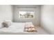 Bright bedroom featuring a queen bed and a large window at 1849 S Helena St, Aurora, CO 80017