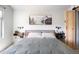 Primary bedroom showcasing a wooden accent wall, a comfortable bed, and bright side tables at 1849 S Helena St, Aurora, CO 80017