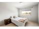 Bright bedroom featuring a queen bed and a large window at 1849 S Helena St, Aurora, CO 80017