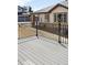 View from a wood deck showing a home's backyard under a clear blue sky at 1849 S Helena St, Aurora, CO 80017