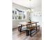 Dining room features a modern light fixture and large window at 1849 S Helena St, Aurora, CO 80017