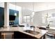 Kitchen with granite countertop and stainless steel dishwasher at 1849 S Helena St, Aurora, CO 80017