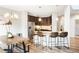 Kitchen with stainless steel appliances, island with seating, and modern lighting at 1849 S Helena St, Aurora, CO 80017