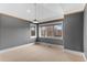 Spacious bedroom with wood accent wall and ample natural light at 7181 Longview Dr, Niwot, CO 80503