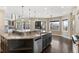 Large kitchen island with granite countertop and stainless steel dishwasher at 7181 Longview Dr, Niwot, CO 80503