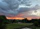 Stunning sunset view over the mountains and neighborhood at 7181 Longview Dr, Niwot, CO 80503