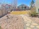 Backyard with a stone walkway, swing set, and manicured lawn, ideal for outdoor activities at 6892 Turnstone Ave, Castle Rock, CO 80104