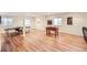 Spacious basement with wood-look flooring, a ping pong table, and foosball table at 6892 Turnstone Ave, Castle Rock, CO 80104