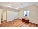 Finished basement with wood-look flooring, closet, and natural light from the window at 6892 Turnstone Ave, Castle Rock, CO 80104
