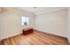 Finished basement space with wood-look floors and a small window at 6892 Turnstone Ave, Castle Rock, CO 80104