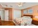 Charming bedroom with wood floors, closet, ceiling fan and natural light from a dual window at 6892 Turnstone Ave, Castle Rock, CO 80104