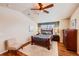 Comfortable bedroom with vaulted ceilings, hardwood floors, and a ceiling fan at 6892 Turnstone Ave, Castle Rock, CO 80104