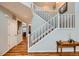 Entryway featuring hardwood floors and a staircase leading to the upper level at 6892 Turnstone Ave, Castle Rock, CO 80104