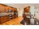 Modern kitchen with stainless appliances, granite counters, stylish cabinets, and hardwood floors at 6892 Turnstone Ave, Castle Rock, CO 80104