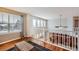 This living room boasts hardwood floors, lots of natural light, and stylish curtains at 6892 Turnstone Ave, Castle Rock, CO 80104