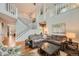 Bright and airy living room with soaring ceilings, hardwood floors, and a cozy sectional sofa at 6892 Turnstone Ave, Castle Rock, CO 80104
