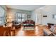 Bright living room with hardwood floors and large window with views of the outdoors at 6892 Turnstone Ave, Castle Rock, CO 80104