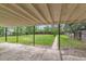 Backyard with covered patio and a large grass area at 1032 Geneva, Aurora, CO 80010