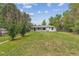Spacious backyard featuring a large grassy area with mature trees at 1032 Geneva, Aurora, CO 80010