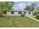 Charming single-story home featuring a well-maintained lawn and white siding at 1032 Geneva, Aurora, CO 80010