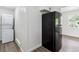 A laundry area with a washing machine and dryer, next to the refrigerator at 1032 Geneva, Aurora, CO 80010