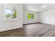 Bright living area with large windows and durable laminate flooring at 1032 Geneva, Aurora, CO 80010