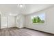 Bright living room featuring fresh paint, new trim, durable laminate floors, and great natural light at 1032 Geneva, Aurora, CO 80010