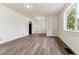 Spacious living room with fresh paint, laminate flooring, and natural light at 1032 Geneva, Aurora, CO 80010