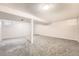 Spacious basement featuring carpeting, windows, and access to the rest of the home at 12700 E Kentucky Pl, Aurora, CO 80012