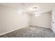 Basement area with carpeting, natural lighting, and access to the rest of the home at 12700 E Kentucky Pl, Aurora, CO 80012