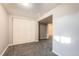 View of finished basement area with carpeting, closet, and access to the rest of the home at 12700 E Kentucky Pl, Aurora, CO 80012
