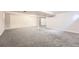 Spacious unfinished basement with neutral paint and plush carpet at 12700 E Kentucky Pl, Aurora, CO 80012