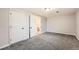Basement area featuring carpeting, access to a staircase, and a closet at 12700 E Kentucky Pl, Aurora, CO 80012