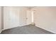 Bedroom with carpeting, closet, and doorway to the rest of the house at 12700 E Kentucky Pl, Aurora, CO 80012