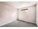 Bright bedroom with neutral walls, carpeting, and a window with coverings at 12700 E Kentucky Pl, Aurora, CO 80012