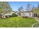Spacious backyard with ample seating, mature landscaping, and shed, creating a serene outdoor oasis at 13661 W Tufts Ave, Morrison, CO 80465