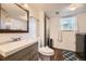 Bright bathroom with a modern vanity, updated fixtures, and stylish accents, perfect for a refreshing start to the day at 13661 W Tufts Ave, Morrison, CO 80465