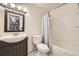 This bathroom has a single sink vanity with a shower and tub combo at 13661 W Tufts Ave, Morrison, CO 80465