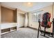This bedroom includes a unique health machine and a window with natural light at 13661 W Tufts Ave, Morrison, CO 80465