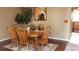 Cozy dining room with wood table set, rug, and decorative plants create a warm, inviting space at 13661 W Tufts Ave, Morrison, CO 80465